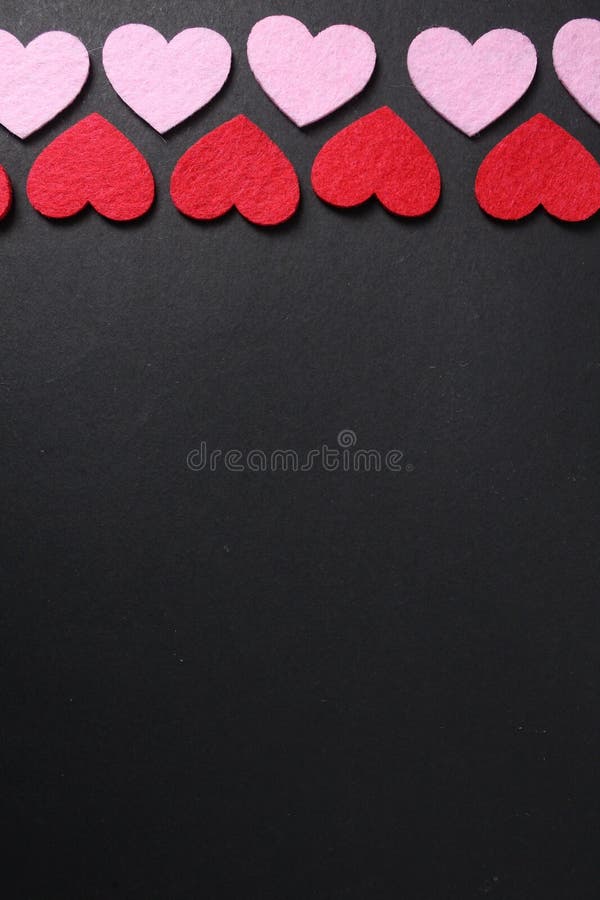 Pink and red hearts on a black copyspace background. Valentine's Day. Day copyspace stock images, royalty-free photos and pictures