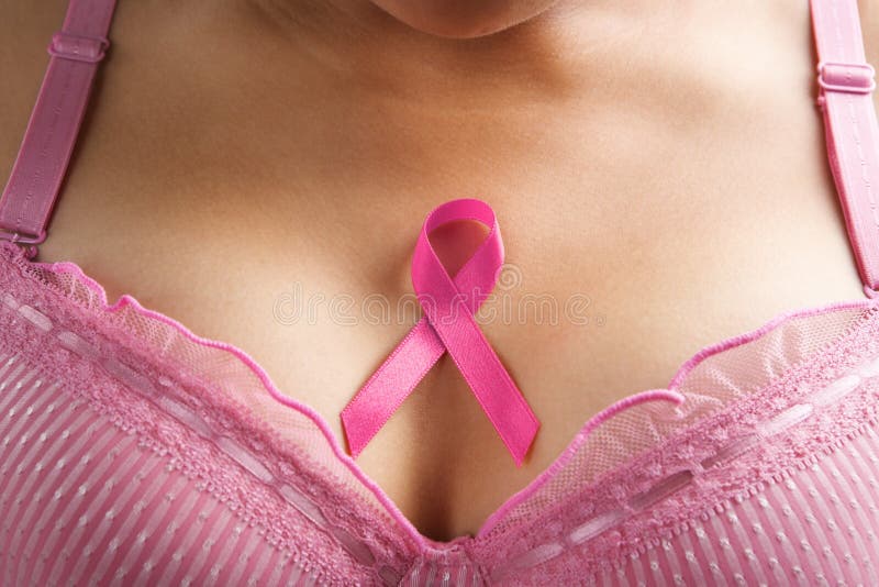 Pink ribbon in woman chest