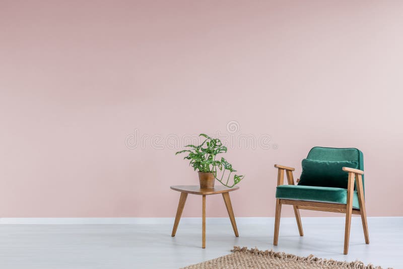 Pink room with green armchair royalty free stock photography