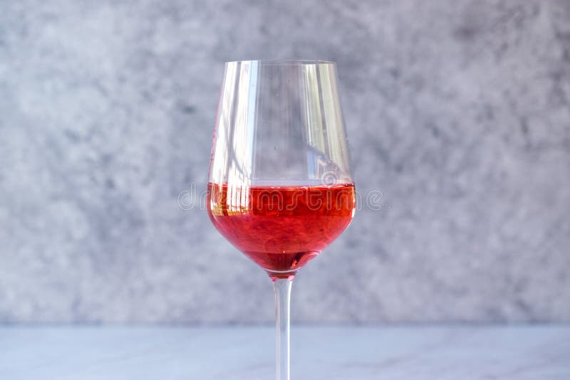 Rose Blush Wine in Glasses. Bottle of Rose Wine with Flowers on