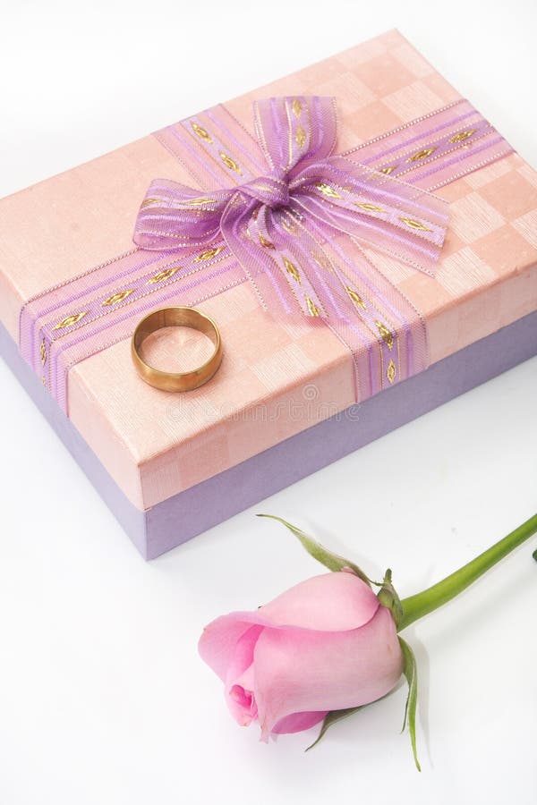 Pink Rose and Wedding Ring on the Pink Gift Box with Bow Stock Photo ...