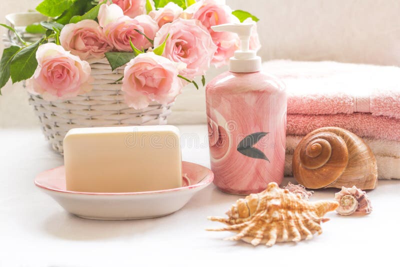 Pink roses, soap, towels and seashells arrangement