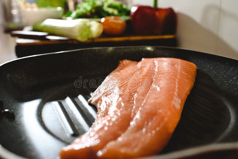 Pink Salmon Fillet in a Frying Pan before Cooking it Stock Image