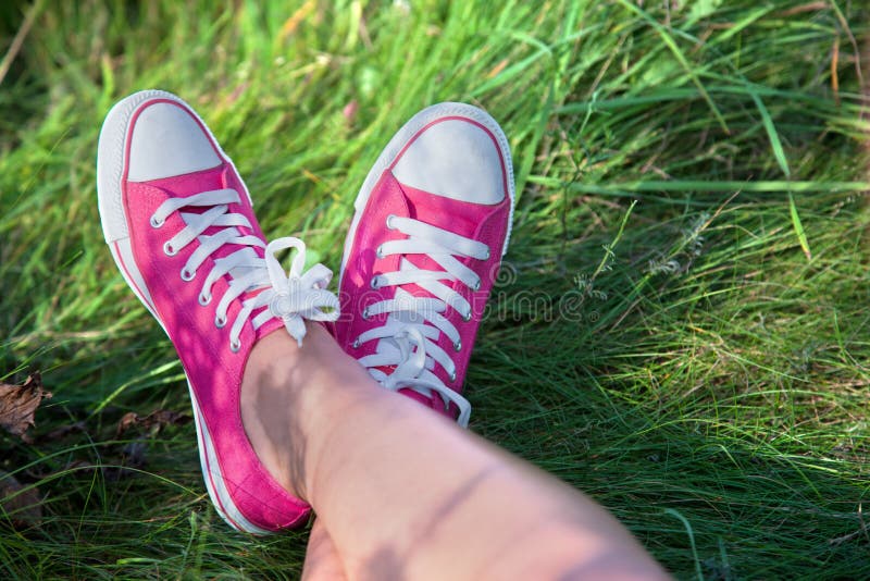 Pink sneakers on girl legs stock photo. Image of sneaker 21489004
