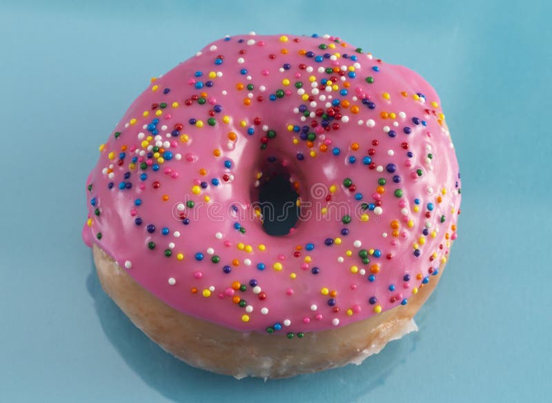 A Pink Sprinkle Donuts on a Turquoise Background Stock Image Image of donuts, bright 150605869