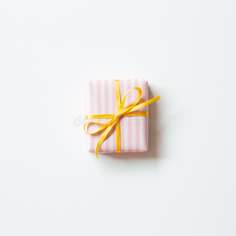 Pink Stripe Pattern Gift Box with Yellow Ribbon Isolated on White