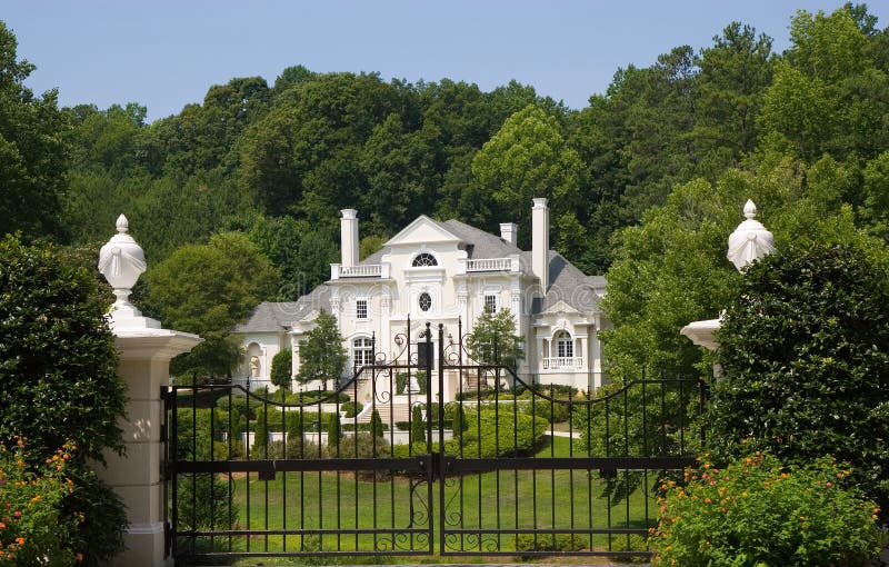 Pink Stucco Mansion Behind Iron Gate