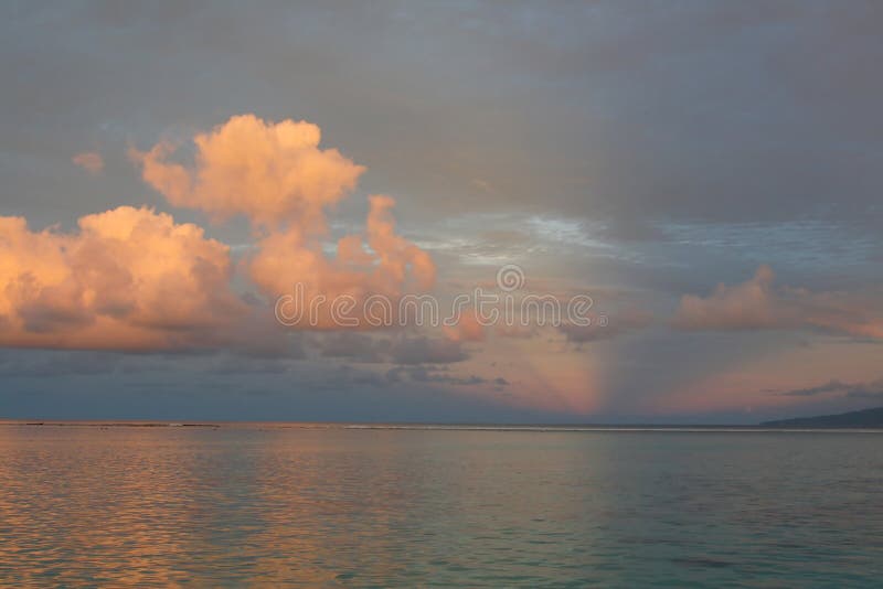 Pink sunset on a tropical coral reef