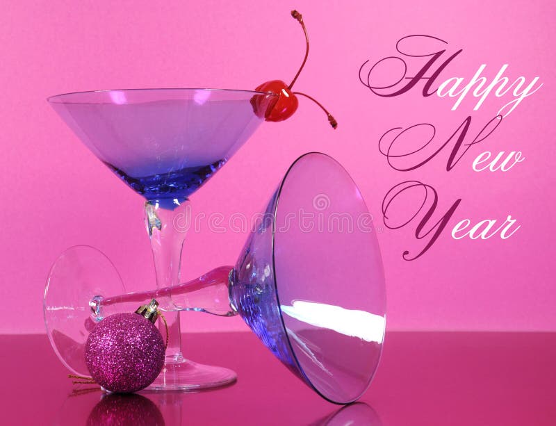 Pink theme Happy New Year party with vintage blue martini cocktail glass and New Years eve decorations