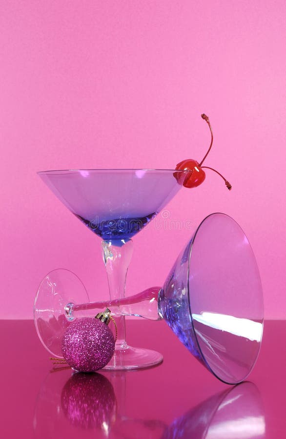 Pink theme Happy New Year party with vintage blue martini cocktail glass and New Years eve decorations