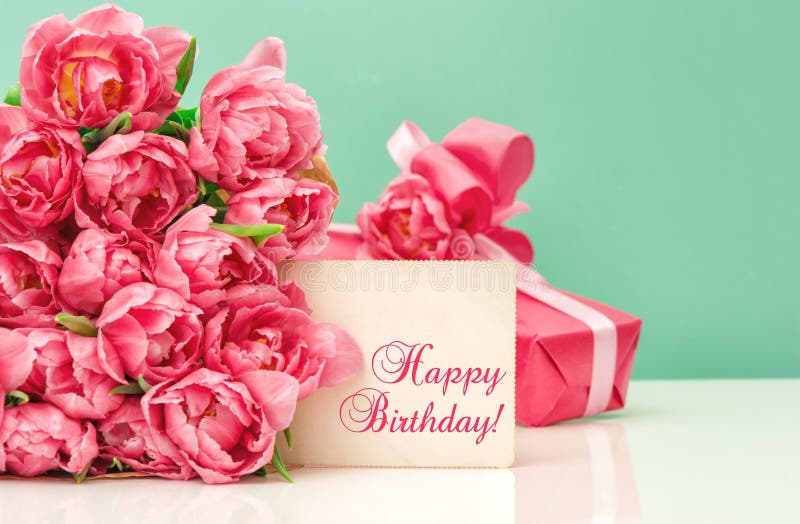 Pink tulips, gift ang greeting card with sample text Happy Birthday!. Pink tulips, gift ang greeting card with sample text Happy Birthday!