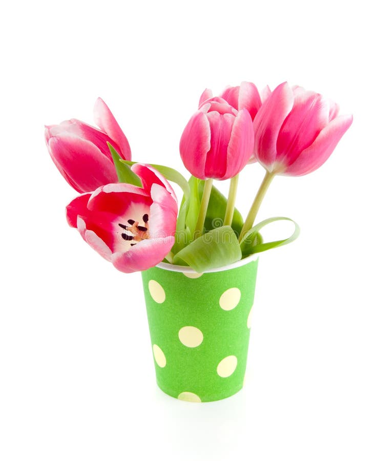 Pink tulips in a green dotted vase