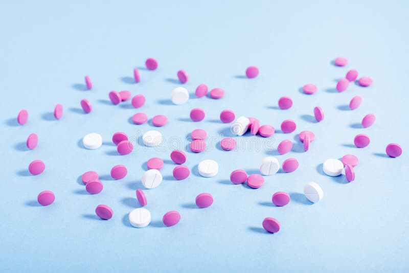 Pink and white pills stock photo. Image of object, medical 117702490