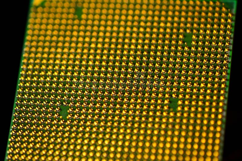 Pins of central processor unit. CPU close-up. Bottom side stock photography
