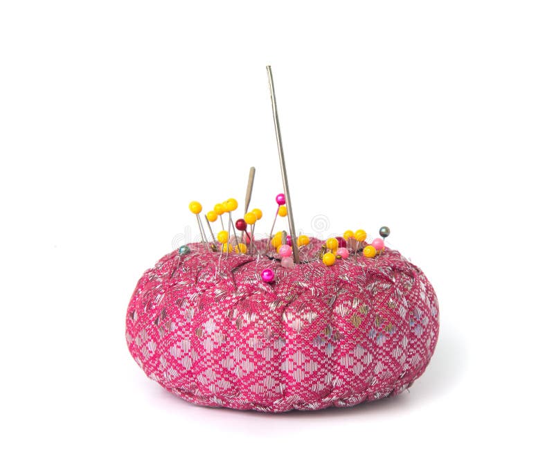 Pins and Needle on Pillow for Sewing on White Background Stock Photo