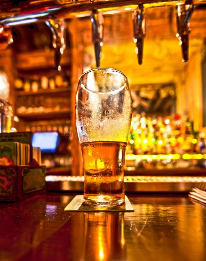 Pint of beer on a bar in a traditional style pub