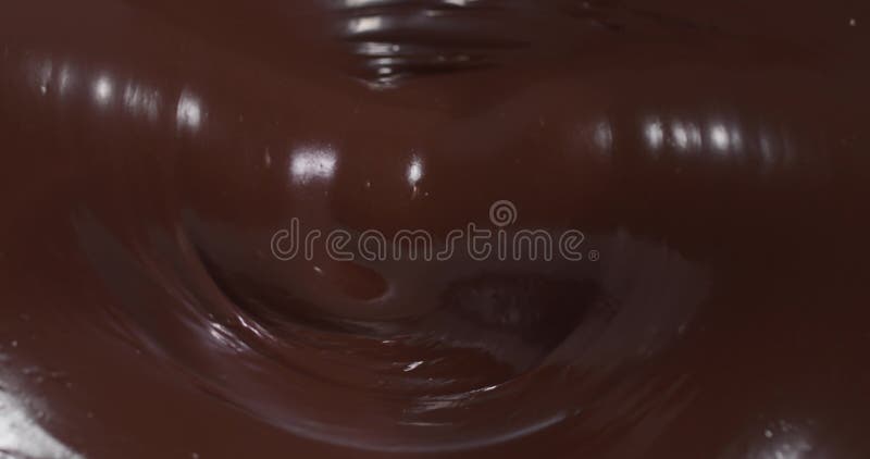 Pintura em detalhe da superfície lisa de chocolate derretido