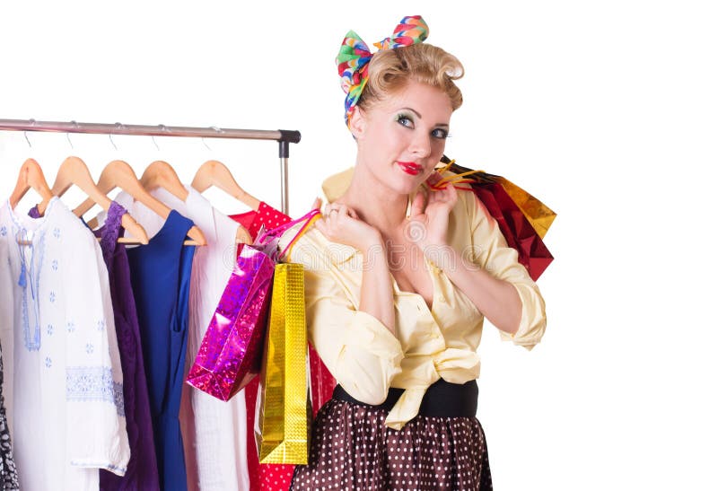 Pinup woman with shopping bags and hanger royalty free stock photo Pinup woman with shopping bags and hanger royalty free stock photo