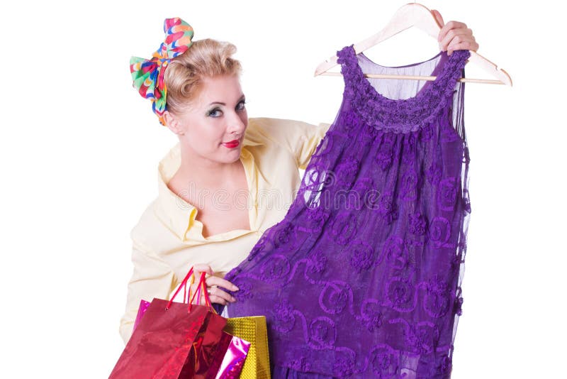 Pinup woman showing dresses with shopping bags stock photos Pinup woman showing dresses with shopping bags stock photos