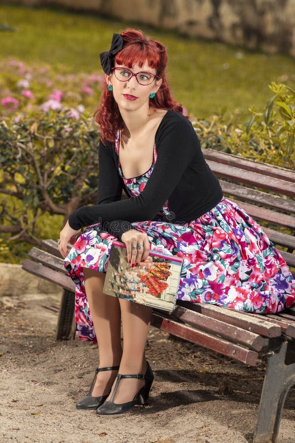 Pinup young woman in vintage style clothing