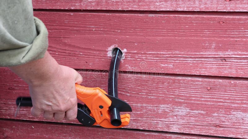 Pipe cutter with ratchet system for cutting HDPE pipes. stock footage