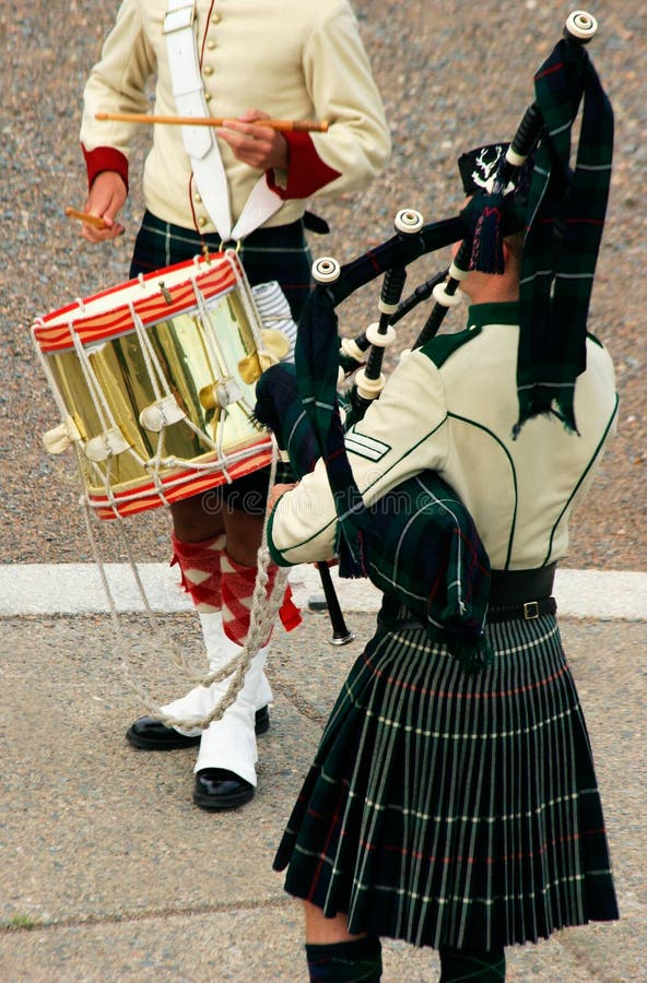 A piper and a drummer are displayed. A piper and a drummer are displayed.
