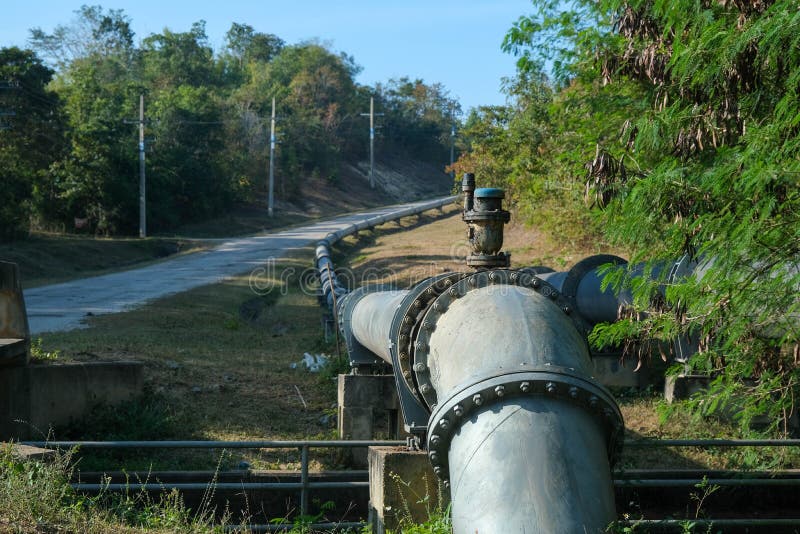 Pipe is Installed Along the Bridge on the Pipe Support. Water Steel Pipes for Community