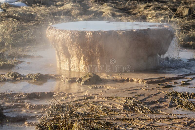 Pipe with waste. Rusty pipe sticks out of ground. Industrial infrastructure stock photography