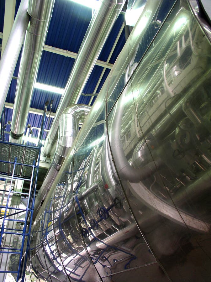 Connected pipes in factory, low angle view. Connected pipes in factory, low angle view