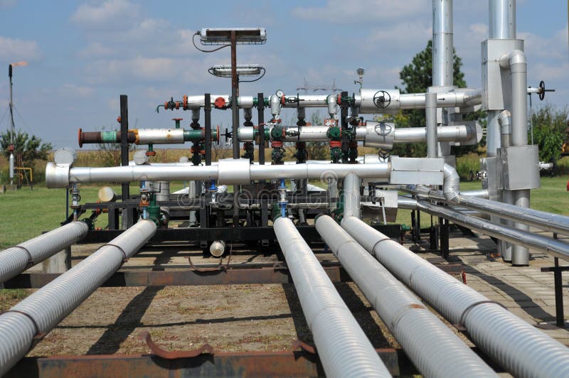 Oil tanks and pipes stock photo. Image of pipeline, railing 18875656