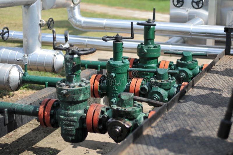 Oil tanks and pipes stock photo. Image of pipeline, railing 18875656