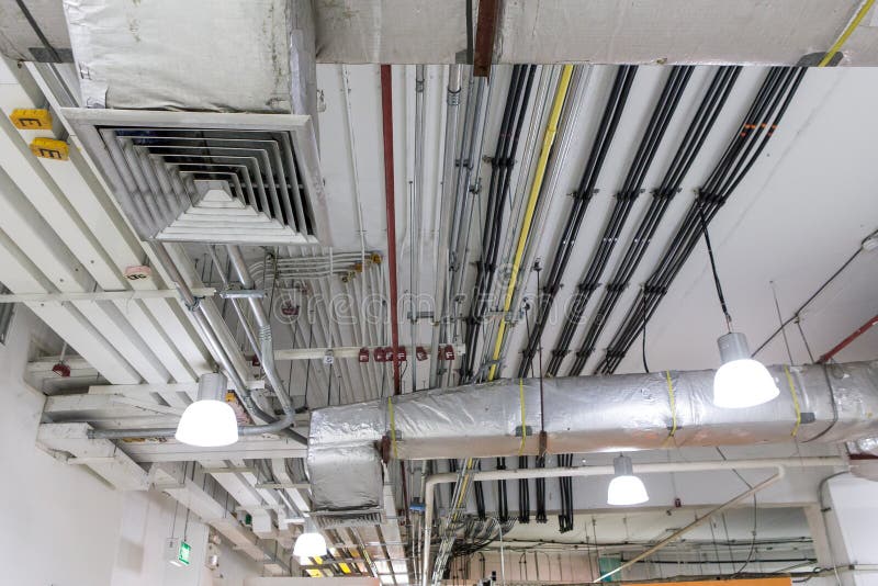 Pipes of Air Conditioning and Ceiling Electric System Stock Photo