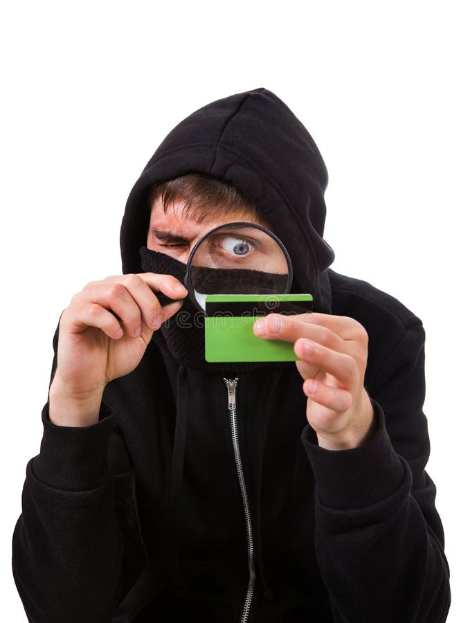 Pirata inform?tico con una tarjeta de banco fotografía de archivo libre de regalías Pirata inform?tico con una tarjeta de banco fotografía de archivo libre de regalías