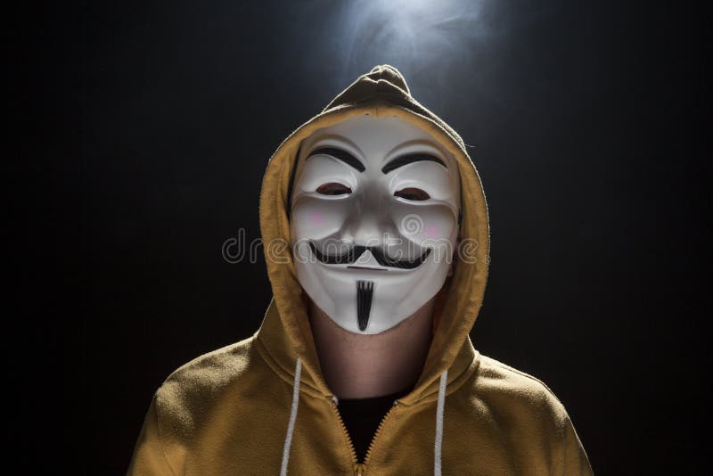 Anonymous activist hacker with mask studio shot on black. Anonymous activist hacker with mask studio shot on black