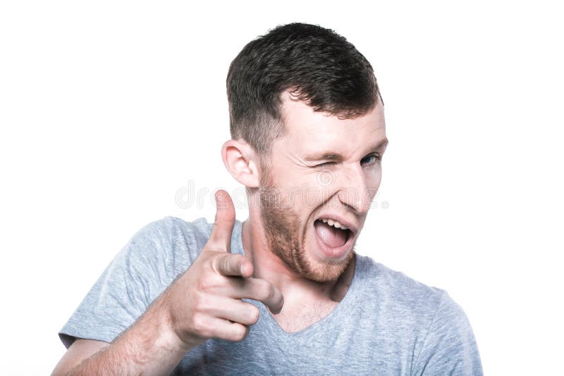 Pisc o homem novo que aponta seu dedo a você imagem de stock royalty free Pisc o homem novo que aponta seu dedo a você imagem de stock royalty free