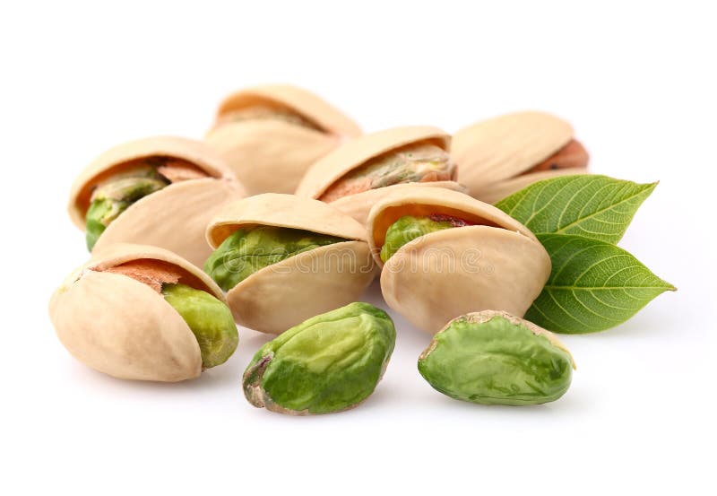 Pistachio nuts with leaves in closeup. Pistachio nuts with leaves in closeup