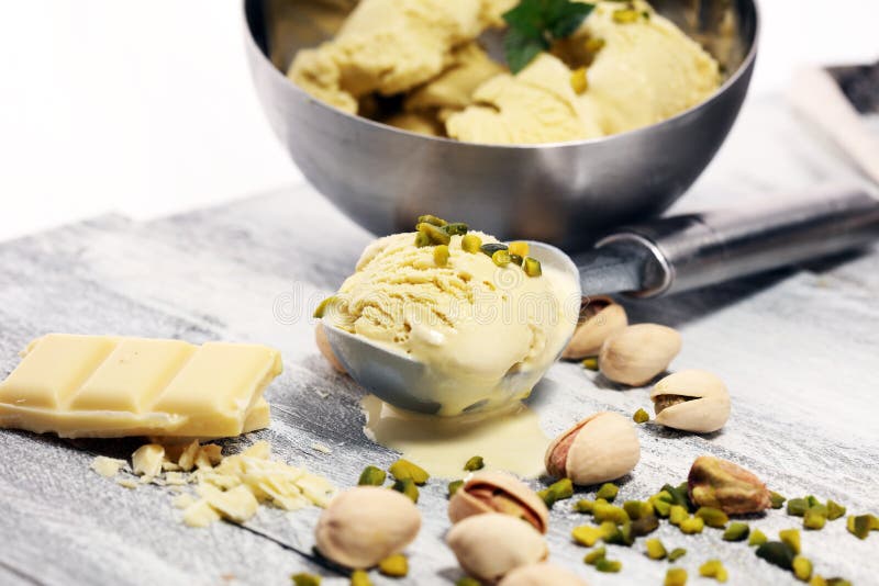 Pistachio Ice Cream Scoop with Chopped Nuts and White Chocolate Stock