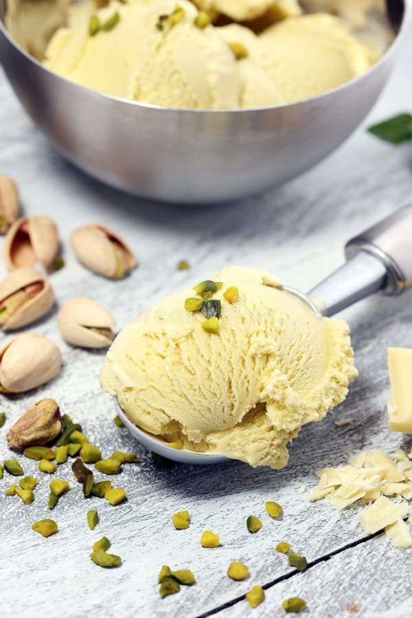 Pistachio Ice Cream Scoop with Chopped Nuts and White Chocolate Stock