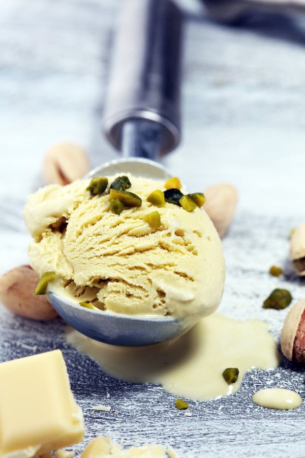 Pistachio Ice Cream Scoop With Chopped Nuts And White Chocolate Stock