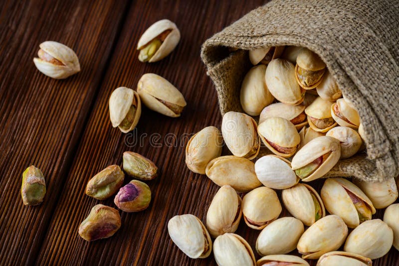 Pistachio Nuts in a Bag on an Old Wooden Surface Stock Image Image of