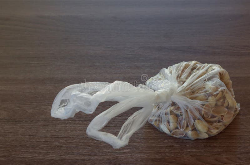 Pistachio Seeds without a Kernel in Dewdrops in a Plastic Bag Stock
