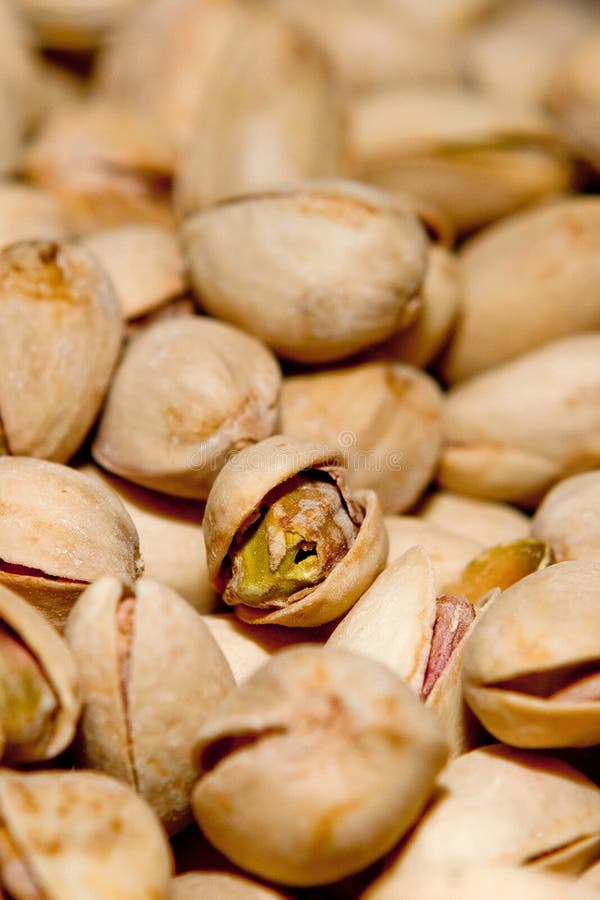 Pistachio texture. Nuts. Green fresh pistachios as texture. Roasted salted pistachio nuts healthy delicious food stock photography Pistachio texture. Nuts. Green fresh pistachios as texture. Roasted salted pistachio nuts healthy delicious food stock photography