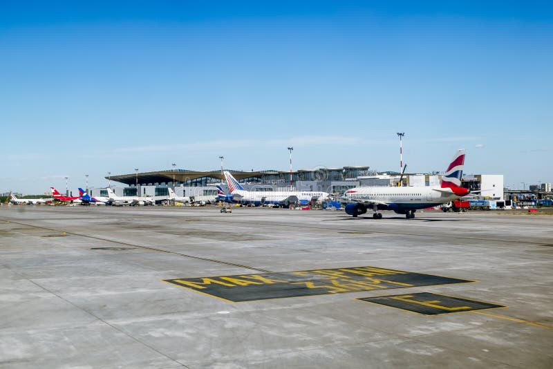 06 June 2015. St. Petersburg.runway with the aircraft at Pulkovo airport in St. Petersburg.Russia. 06 June 2015. St. Petersburg.runway with the aircraft at Pulkovo airport in St. Petersburg.Russia.