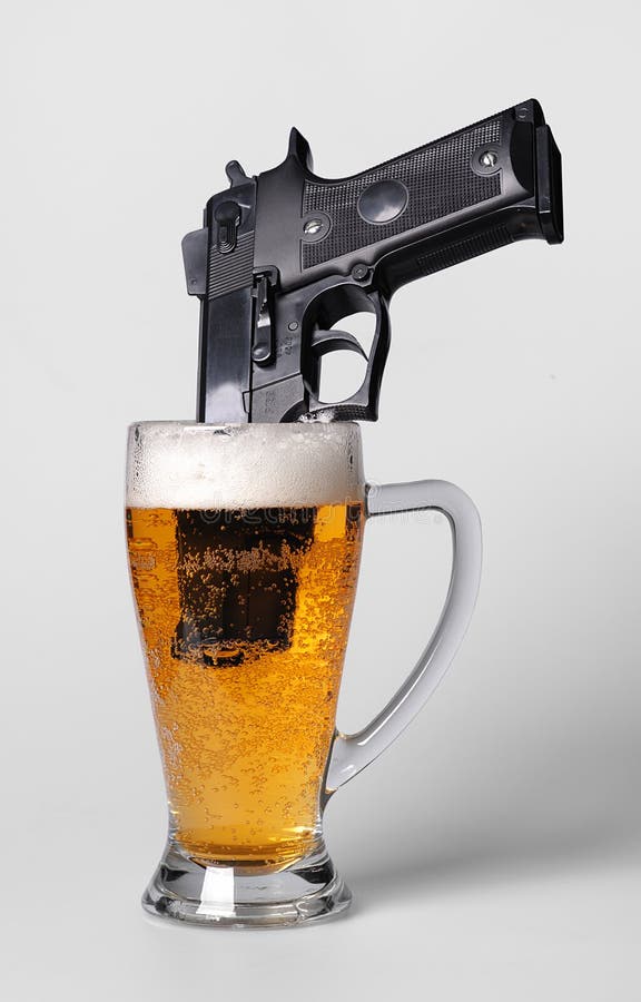 Pistol in beer glass stock photo. Image of foam, booze 17041222