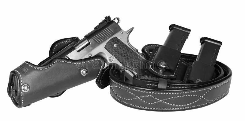 Isolated automatic pistol with belt, holster, and magazines. Isolated automatic pistol with belt, holster, and magazines