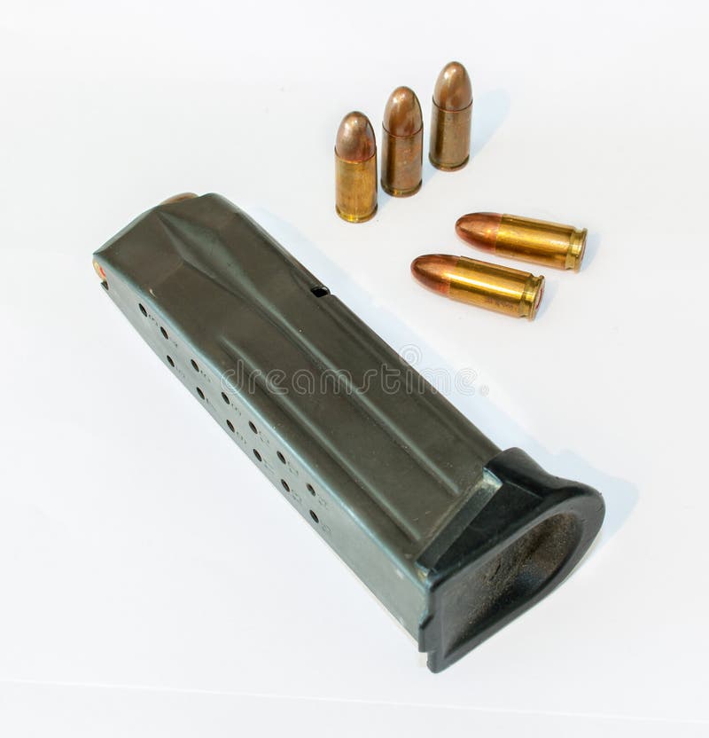 Pistol magazine and ammo stock photo