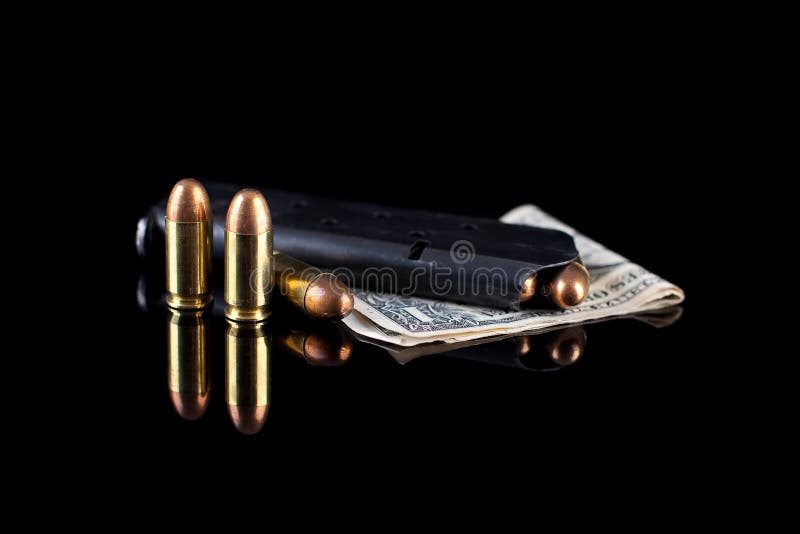 Pistol magazine with ammunition on black royalty free stock photography