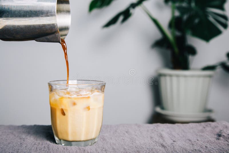 Pitcher Pour Brewed Coffee Making Latte Coffee on Table and Coffee