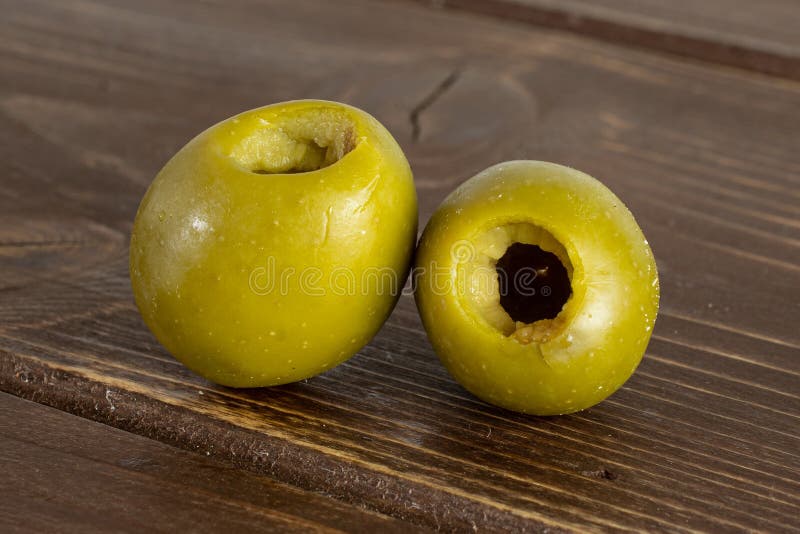 Pitted Green Olive on Brown Wood Stock Photo Image of close, olive