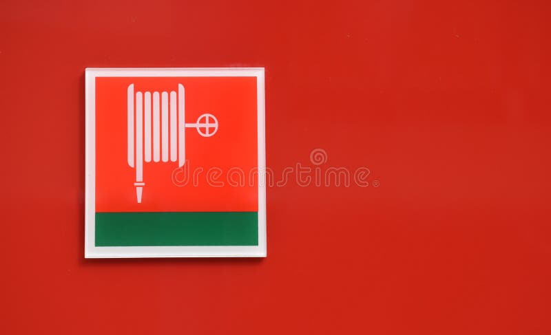Pittogramma di sicurezza: Segno dell'avvolgitore per tubo del fuoco immagine stock